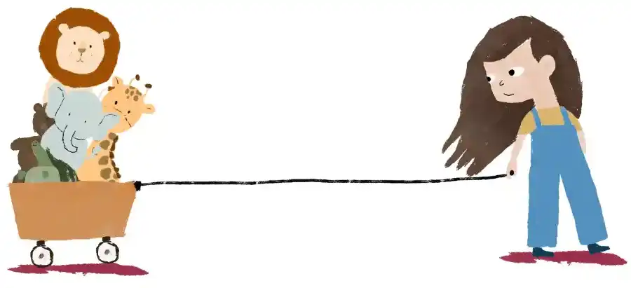 Mädchen zieht ihre Stofftiere im Wagen