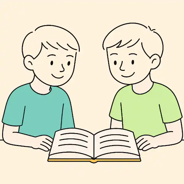 Zwei Jungen lesen ein Buch gemeinsam – Tandemlesen zur Förderung der Leseflüssigkeit
